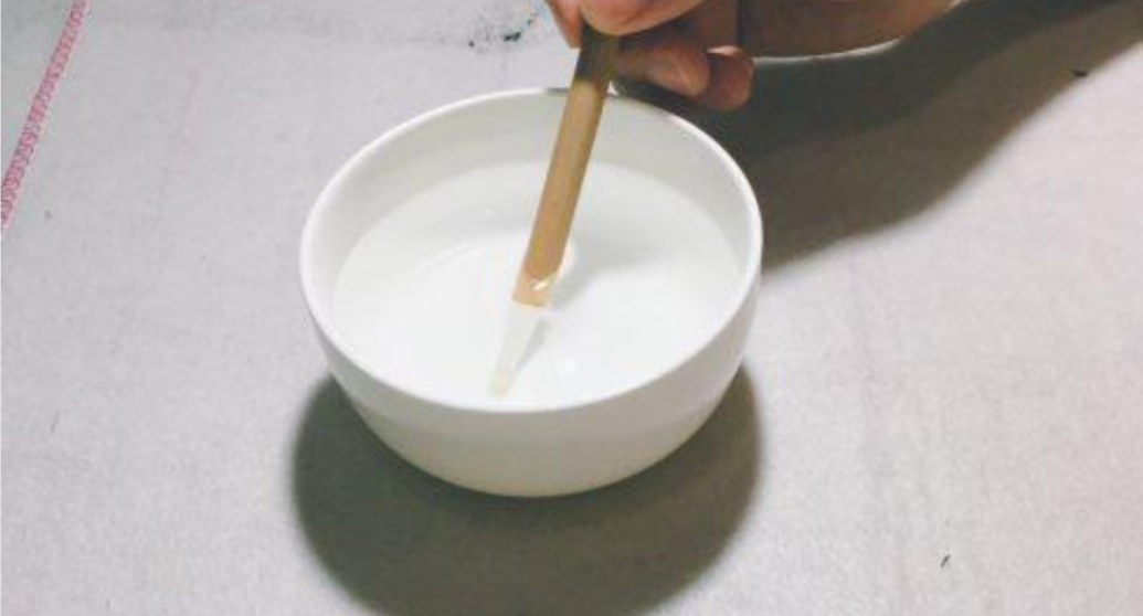 Submerge the entire brush head into the water.