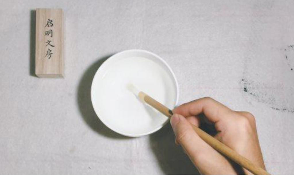 To speed things up, you can gently press the tip of the brush against the bottom of the bowl.
