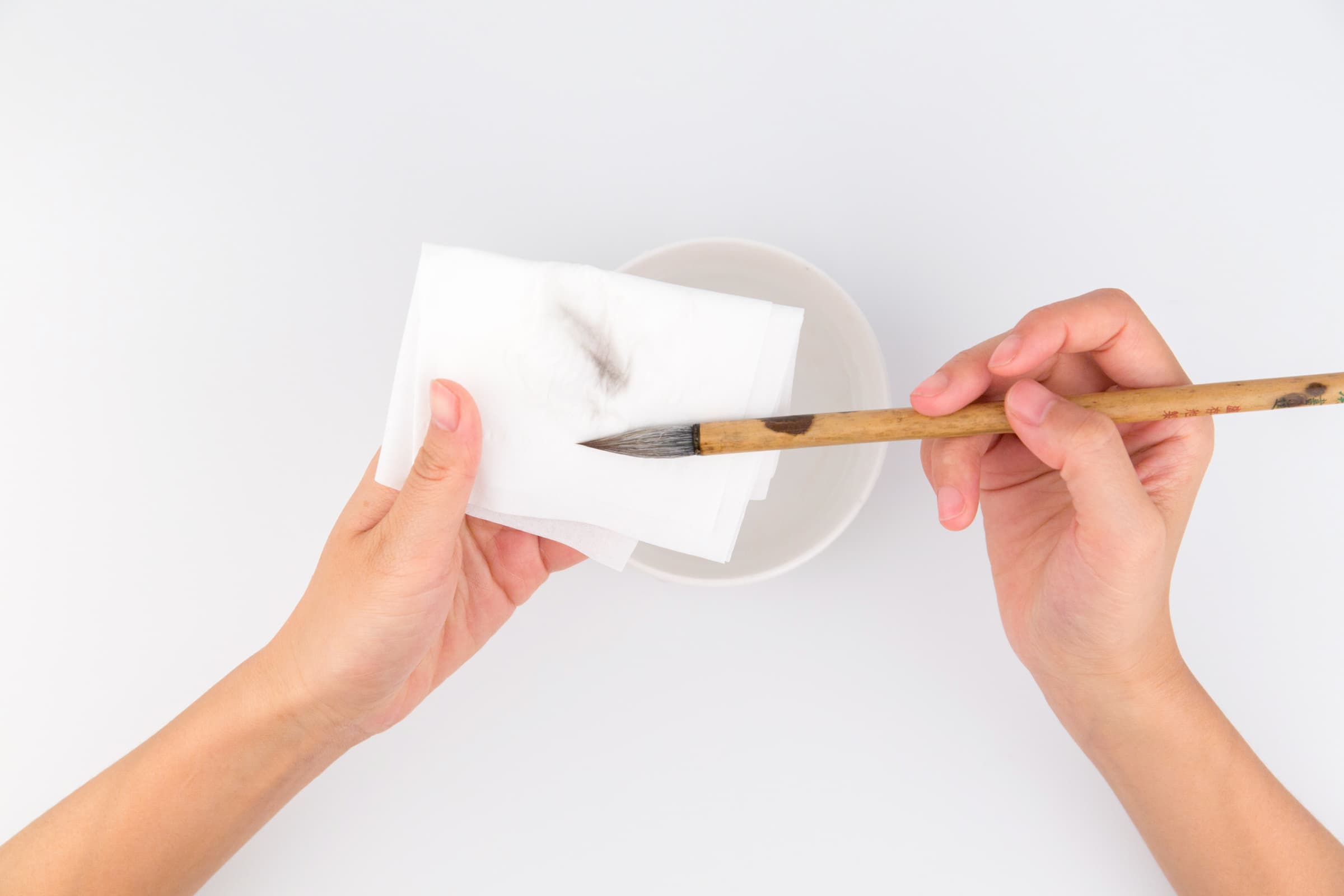 use a clean paper towel to absorb any extra water.