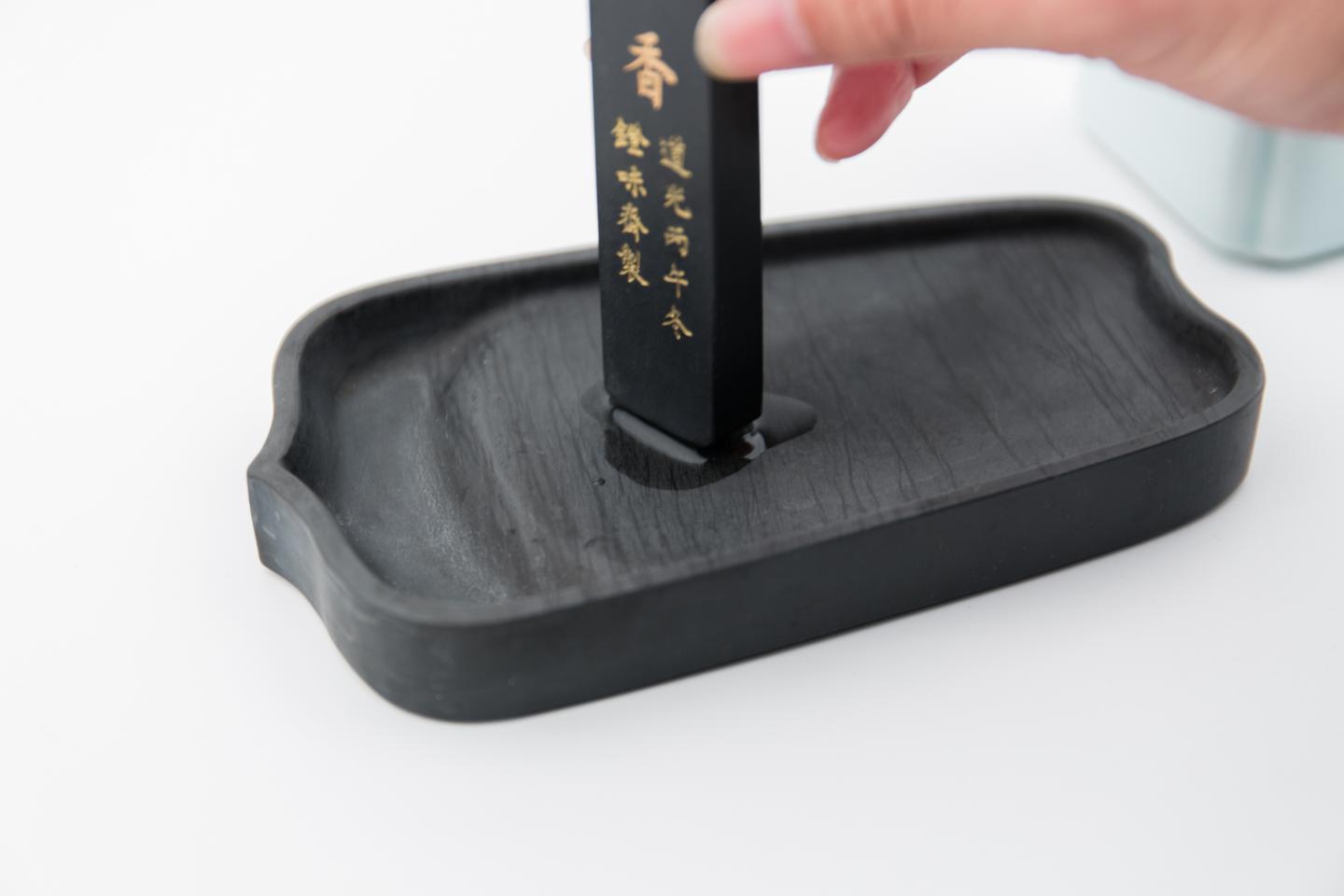 dip the ink stick in water